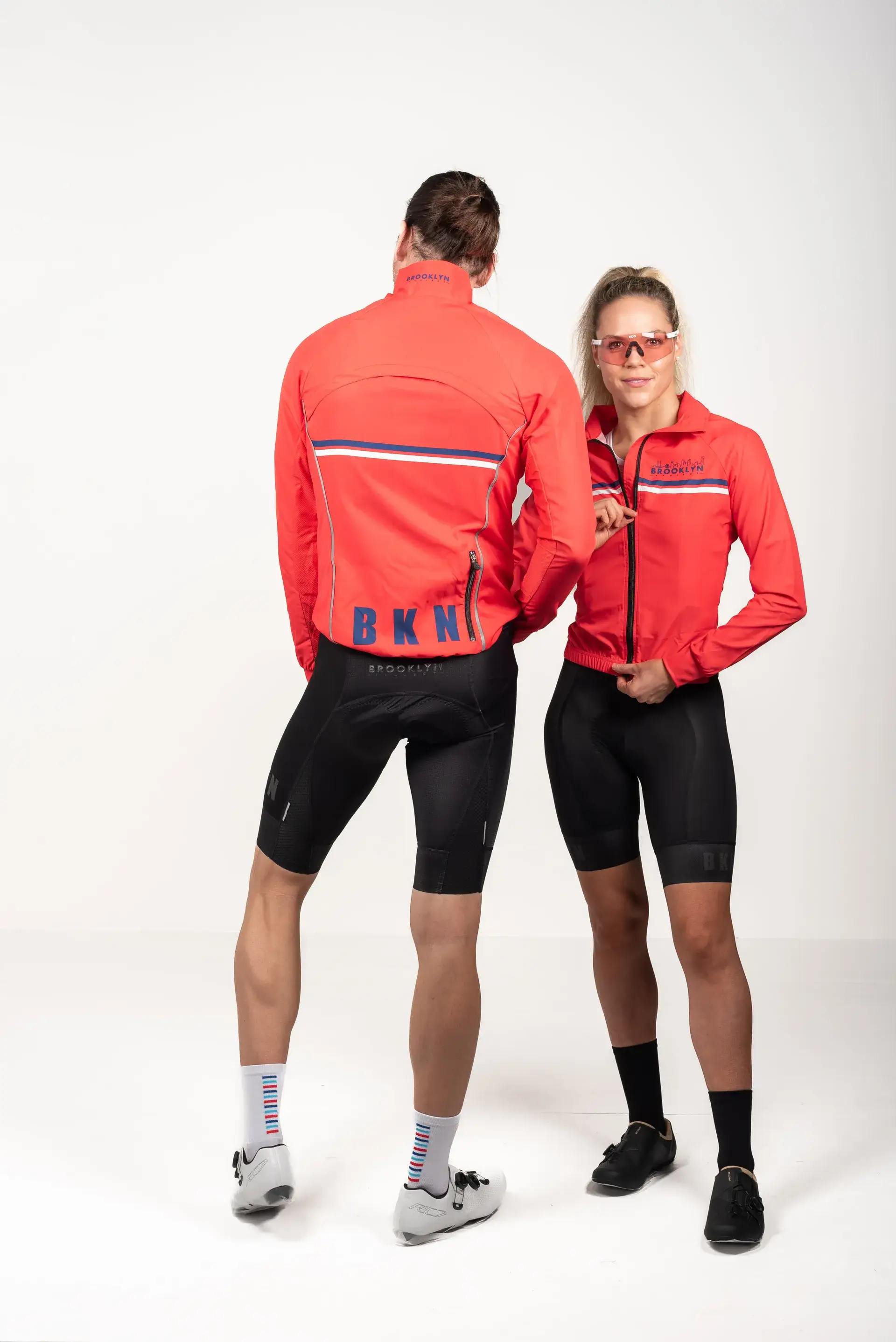 Mens-Capsule-Cycling-Spray-Jacket-Coral-model